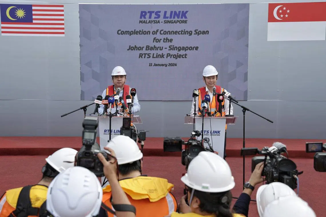 Singapore’s Acting Minister for Transport Chee Hong Tat (right) and Malaysia Transport Minister Loke Siew Fook at a ceremony to mark the completion of a connecting span for the JB-Singapore RTS Link on Jan 11. 