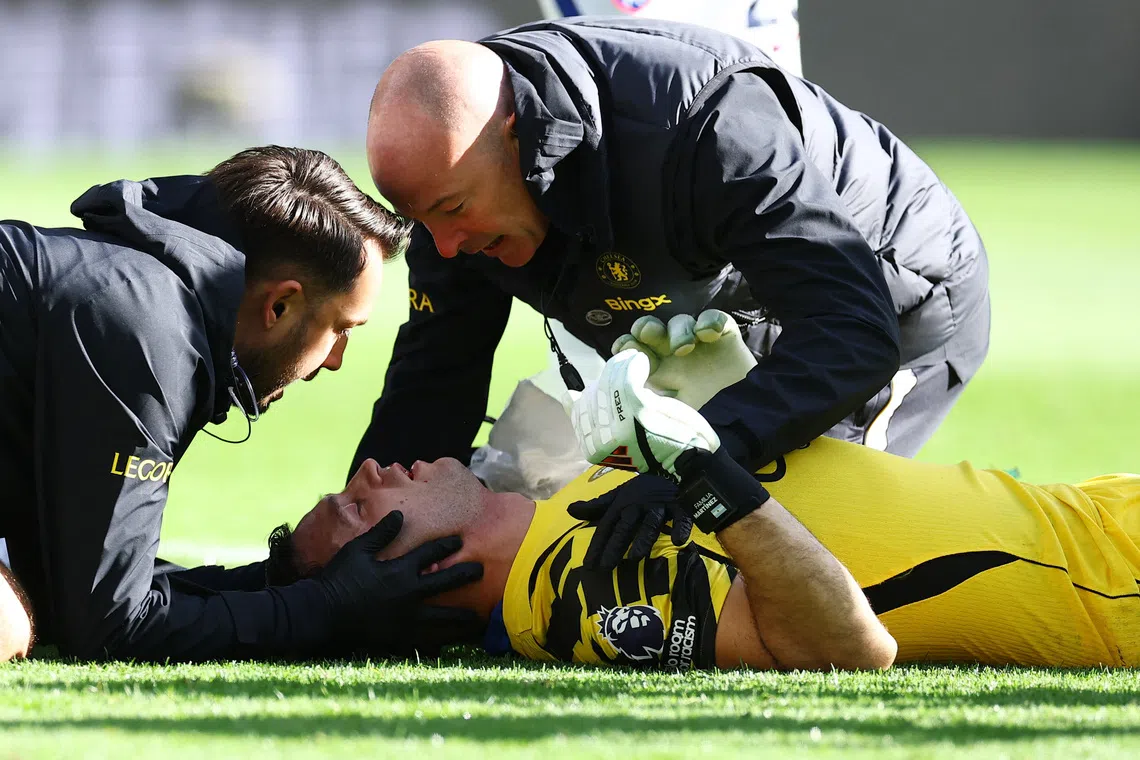 FILE PHOTO: Chelsea's Emiliano Martinez receives medical attention after sustaining an injury at Hill Dickinson Stadium, Liverpool, Britain on October 17, 2026. REUTERS/Phil Noble/File Photo