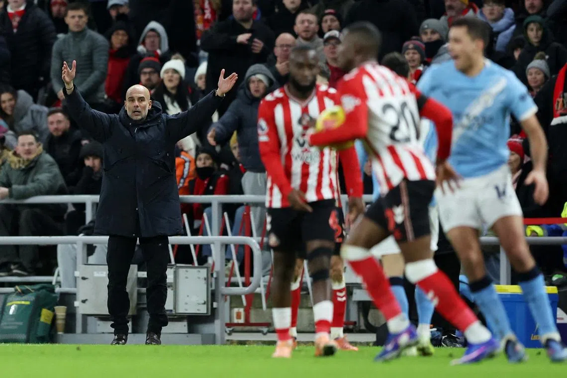 Soccer Football - Premier League - Sunderland v Manchester City - Stadium of Light, Sunderland, Britain - January 1, 2026 Manchester City manager Pep Guardiola reacts. REUTERS/Scott Heppell