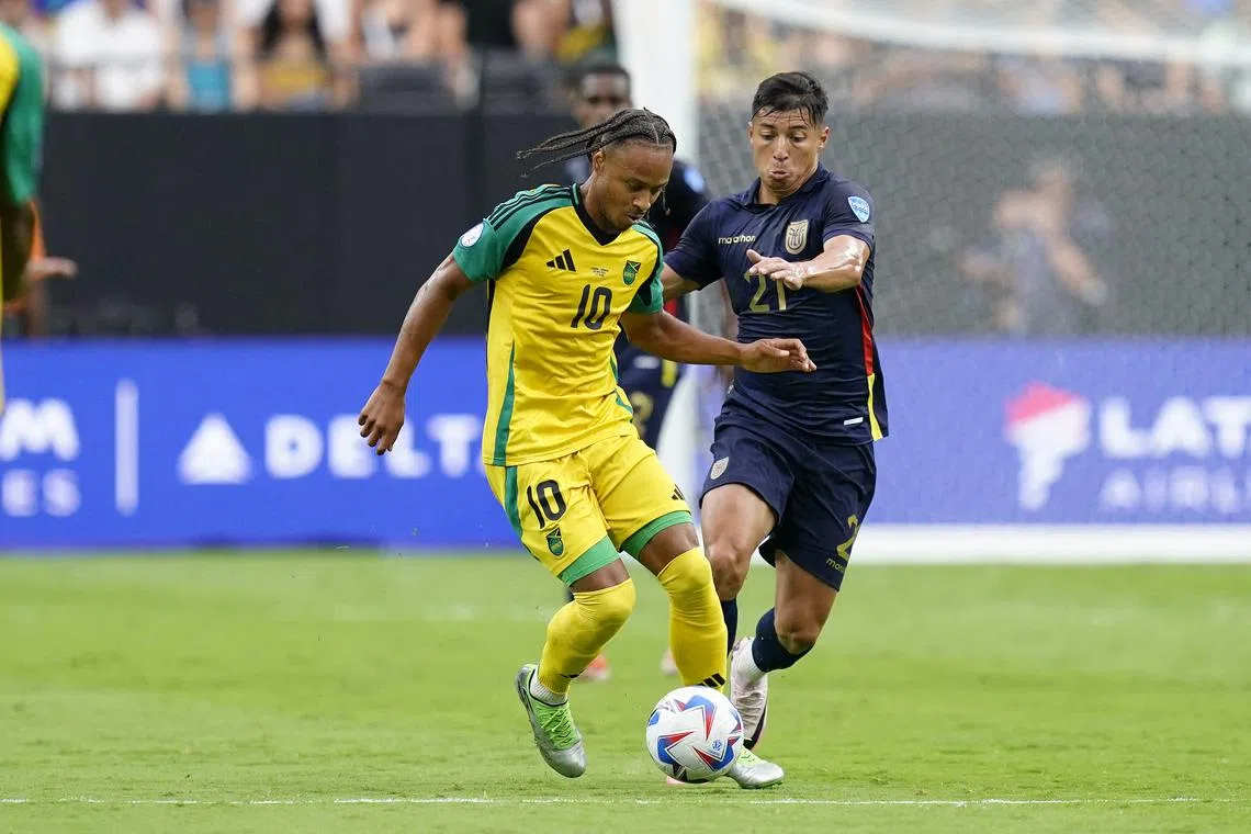 Jun 26, 2024; Las Vegas, NV, USA;  Jamaica forward Bobby De Cordova-Reid (10) battles for the ball against Ecuador midfielder Alan Franco (21) during the first half of a Copa America match at Allegiant Stadium. Mandatory Credit: Lucas Peltier-USA TODAY Sports/File Photo