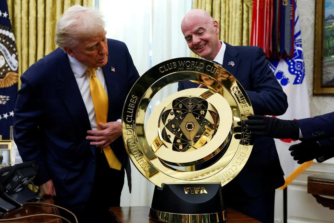 US President Donald Trump and Fifa  president Gianni Infantino checking out the Fifa Club World Cup trophy in the Oval Office of the White House, on March 7.  
