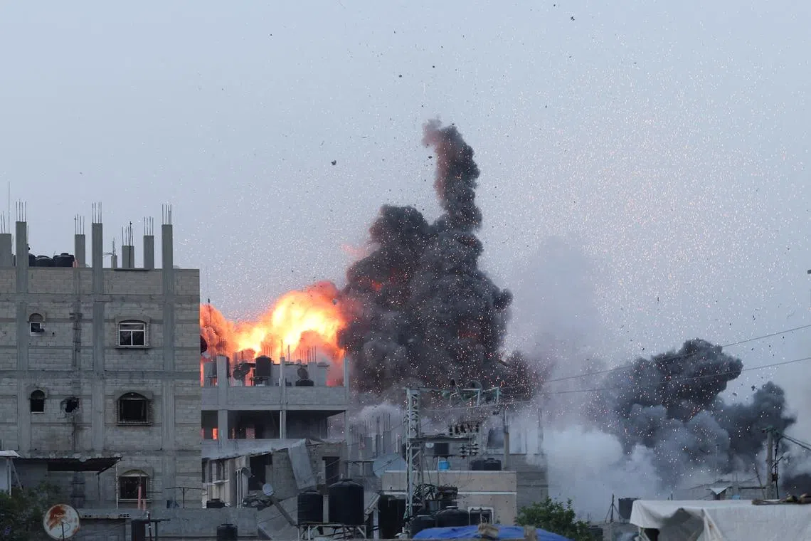FILE PHOTO: Smoke and flames rise during an Israeli air strike in central Gaza Strip, June 3, 2024. REUTERS/Ramadan Abed/File Photo