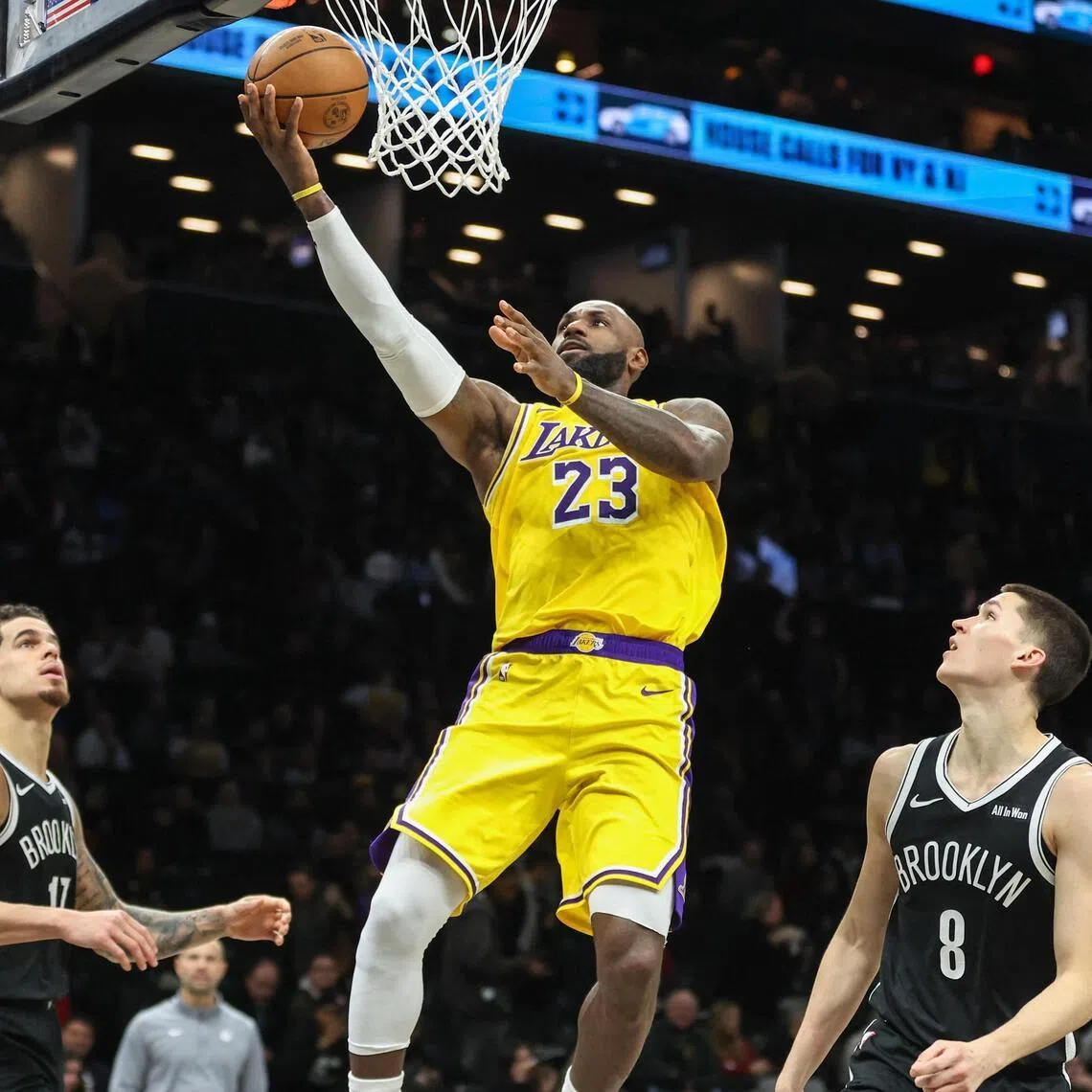 Los Angeles Lakers forward LeBron James drives past Brooklyn Nets guard Egor Demin in the third quarter at Barclays Center. 