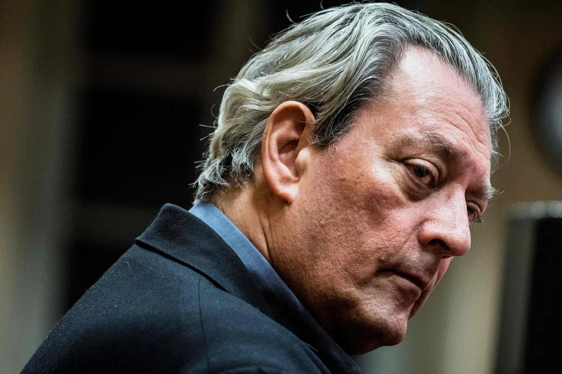 (FILES) US writer Paul Auster looks on in Lyon on January 16, 2018. Paul Auster, the prolific American author whose works included "The New York Trilogy," has died of complications from lung cancer, the New York Times reported April 30, 2024. He was 77. Auster died at his home in Brooklyn, the newspaper said, citing a friend of the novelist, Jacki Lyden. (Photo by JEFF PACHOUD / AFP)