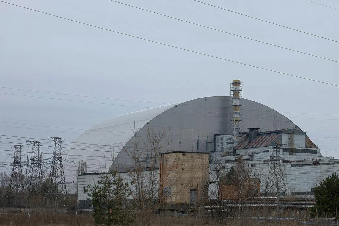 FILE PHOTO: A general view shows the New Safe Confinement (NSC) structure, that covers the old sarcophagus which confines the remains of the damaged fourth reactor, at the Chornobyl Nuclear Power Plant, amid Russia's attack on Ukraine, in Kyiv region, Ukraine April 12, 2025.  REUTERS/Valentyn Ogirenko/File Photo