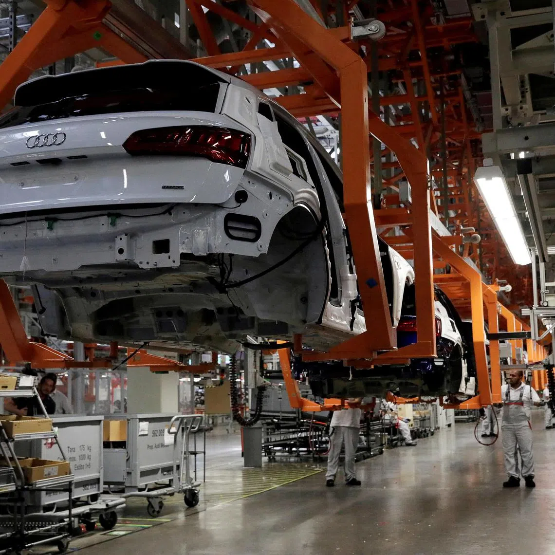 FILE PHOTO: Employees work at an Audi Q5 2.0 production line of the German car manufacturer's plant during a media tour in San Jose Chiapa, Mexico April 19, 2018. REUTERS/Henry Romero/File Photo