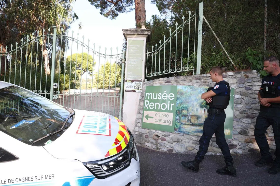 Police officers patrolling in front of the entrance of the Renoir Museum after four paintings, two of which were left behind, were stolen from the museum in an early-morning break-in.