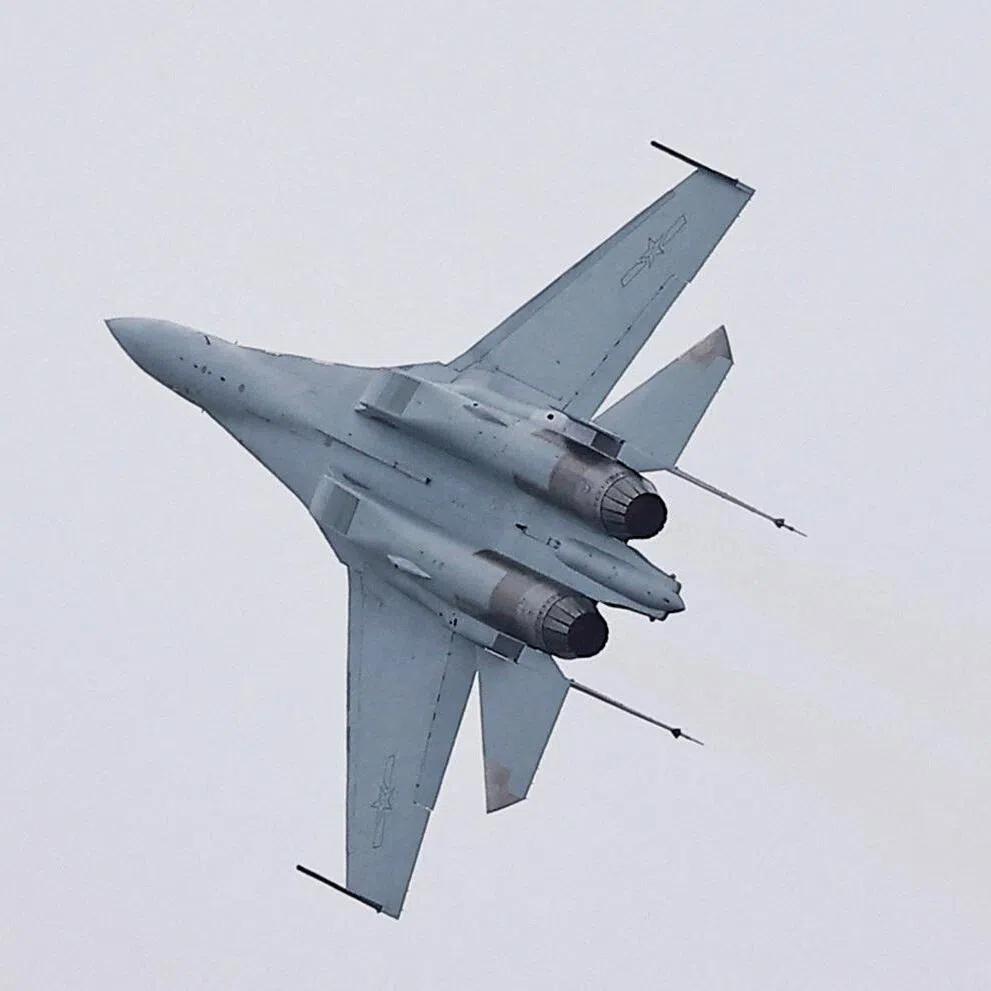 FILE PHOTO: A J-16 fighter jet performs at the China International Aviation and Aerospace Exhibition, or Airshow China, in Zhuhai, Guangdong province, China November 14, 2024. REUTERS/Tingshu Wang/File Photo