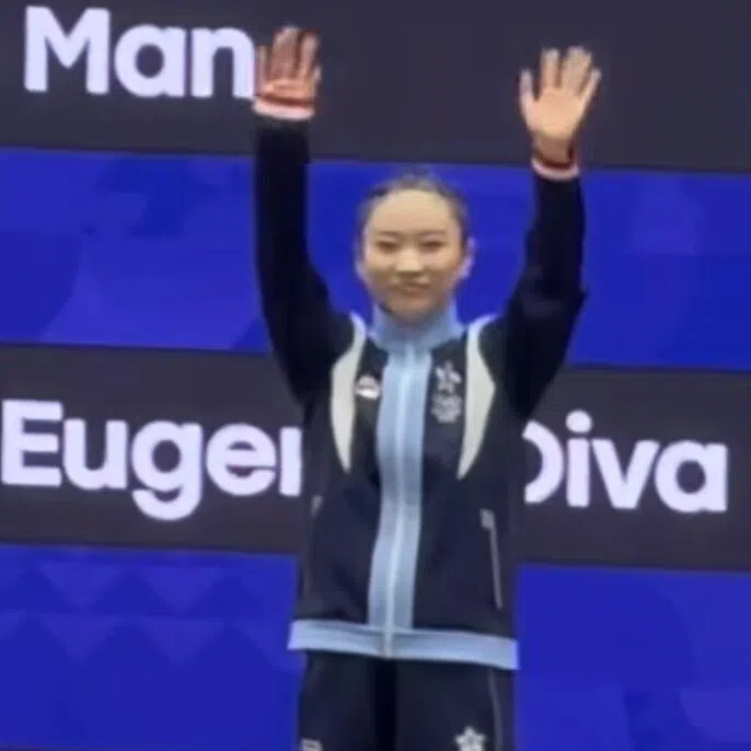 Wushu athlete Lydia Sham (right) won by just 0.003 points, fulfilling a promise she had made to Kai (left), her favourite member of K-pop boy band Exo.