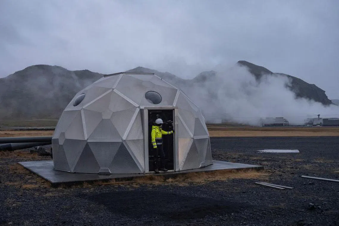 FILE PHOTO: Silja Yraola, an employee of Icelandic startup Carbfix, enters the dome with injection well at its facility in Olfus, Iceland, November 21, 2023. Icelandic startup Carbfix is the world's first CO2 mineral storage operator, permanently sequestering CO2 by mixing it with water and injecting into basalt rock. At its facility in Olfus, on the southwestern coast of Iceland, CO2 piped in from the nearby power plant is being mixed with water drawn up from the ground and injected into the basalt rock below. REUTERS/Marko Djurica/File Photo