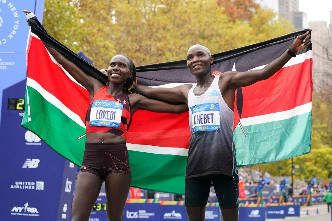 Kenya's Sharon Lokedi (left), winner of the Women's Division, and Kenya's Evans Chebet, winner of the Men's Division, in New York on Nov 6, 2022..