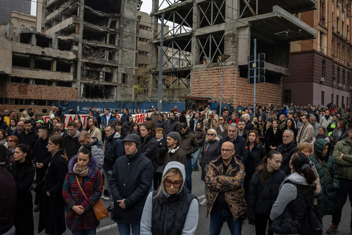 People attend a protest in front of a former army headquarters over a new law to speed its conversion into a luxury compound leased to an investment company founded by U.S. President Donald Trump's son-in-law, Jared Kushner, in Belgrade, Serbia, November 11, 2025. REUTERS/Marko Djurica