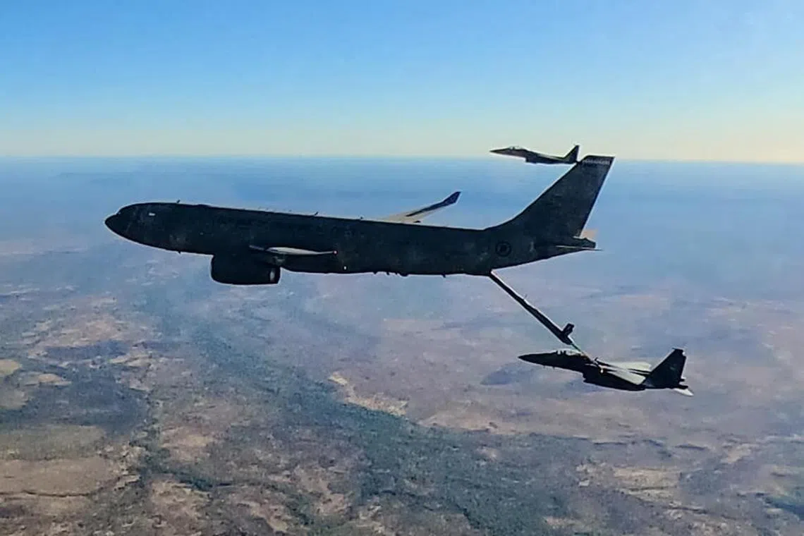 The Republic of Singapore Air Force's A330 MRTT conducting air-to-air refuelling with F-15SG.