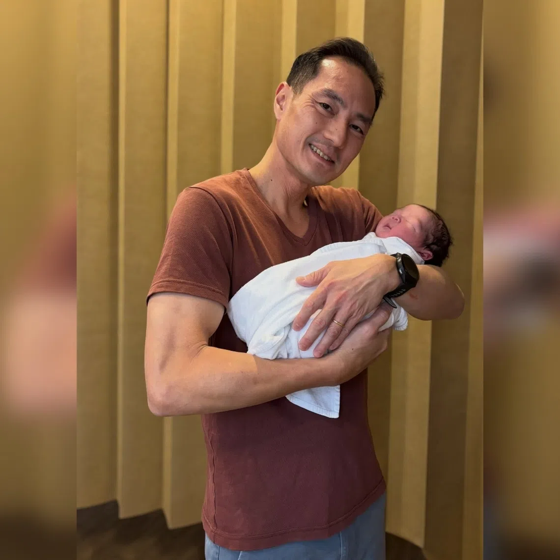 Tan Kiat How with his third child Micah.