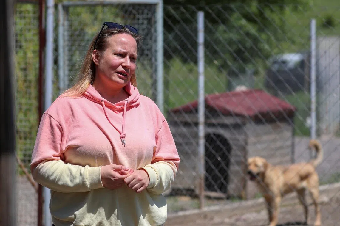 Sara Kemecsei, the owner of an animal shelter who solicits small donations mostly from abroad and may be impacted by the 'foreign agents' law, speaks during an interview in Tbilisi, Georgia, May 27, 2024. REUTERS/Irakli Gedenidze