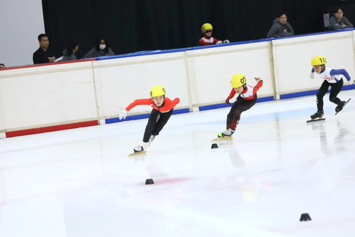 Singapore's Raeon Zhang (left) clinched two silvers at the Asian Open.