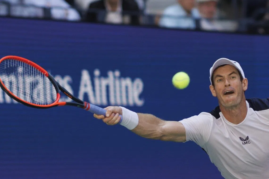 Andy Murray returns the ball to Grigor Dimitrov during their second round match at the US Open.
