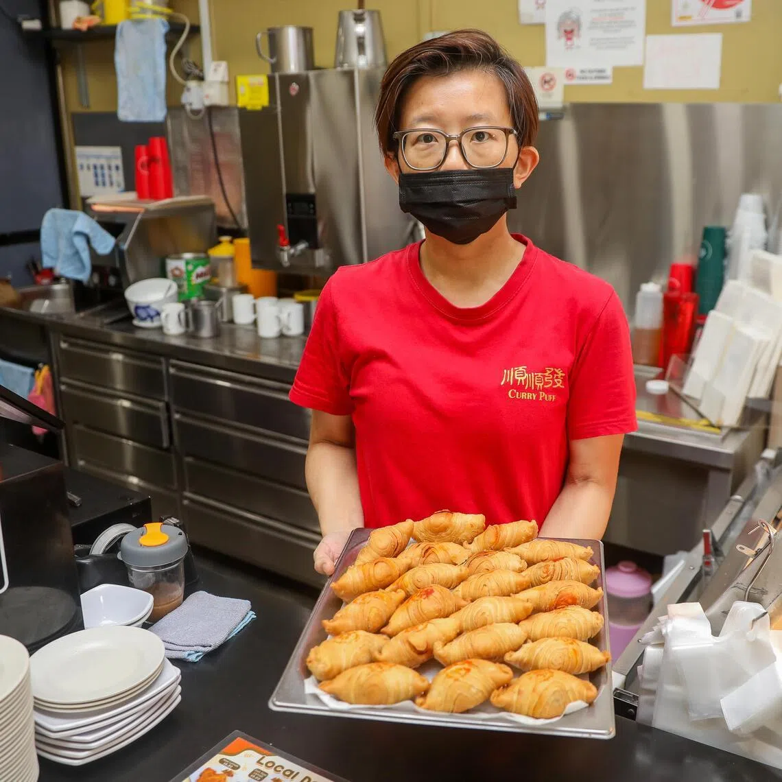 Pic1 to Pic3: Profile of Mdm Tay Meilan, 44, who is the third generation owner of Soon Soon Huat Curry Puff. Taken at 220E East Coast Road.