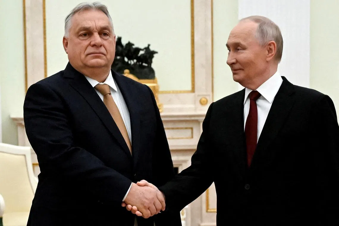 FILE PHOTO: Russian President Vladimir Putin shakes hands with Hungarian Prime Minister Viktor Orban during a meeting in Moscow, Russia, November 28, 2025. Alexander Nemenov/Pool via REUTERS/File Photo