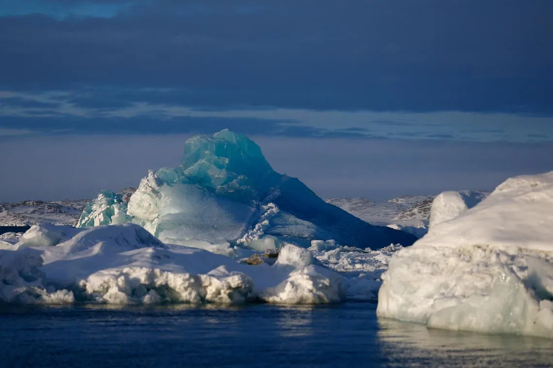 FILE PHOTO: An iceberg floats around ice near Nuuk, Greenland, February 9, 2025. REUTERS/Sarah Meyssonnier/File photo