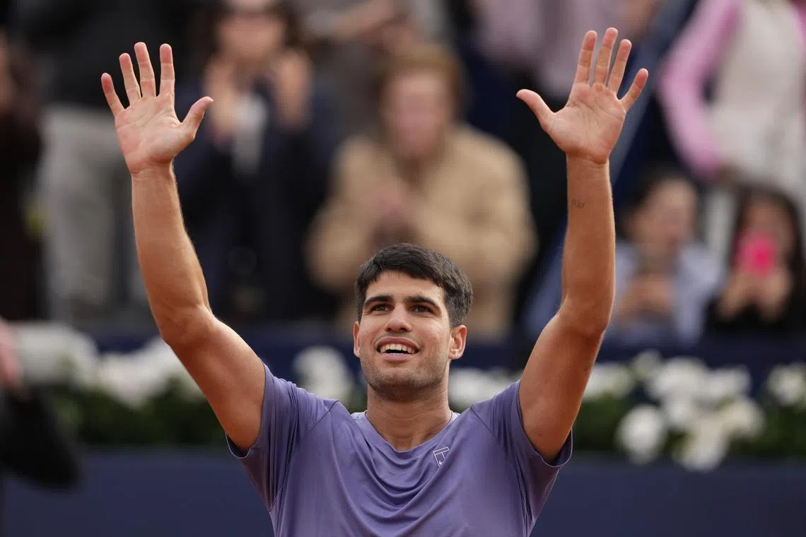 Spain's Carlos Alcaraz celebrates winning his first-round match against against Ethan Quinn of the US.