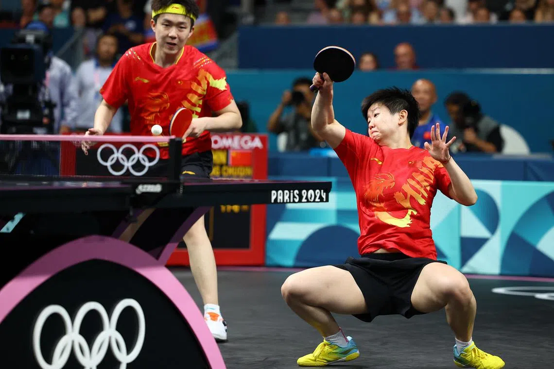 Wang Chuqin and Sun Yingsha of China during their Paris Olympics table tennis mixed doubles final against North Korea on July 30, 2024.
