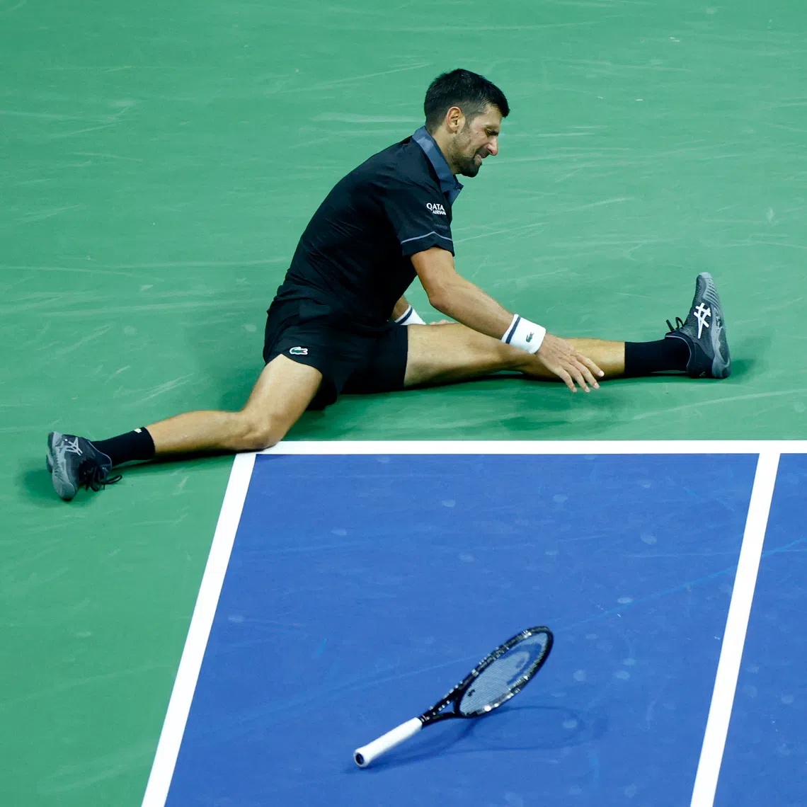 Tennis - U.S. Open - Flushing Meadows, New York, United States - August 30, 2026 Serbia's Novak Djokovic lies on the court during his first round match against Argentina's Mariano Navone REUTERS/Jeenah Moon