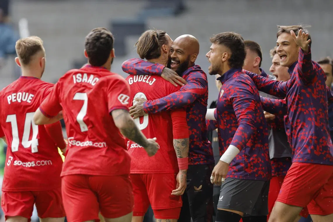 Sevilla's Nemanja Gudel (second from left) celebrating with teammates after scoring against Celta Vigo in their Spanish La Liga match at Abanca-Balaidos Stadium in Vigo on May 10. But they lost 3-2 and are just two points off the drop zone.