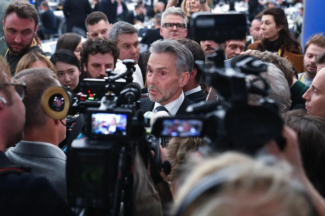 Dutch Prime Minister Dick Schoof (centre) talking to the media at a European Council summit in Budapest on Nov 8.