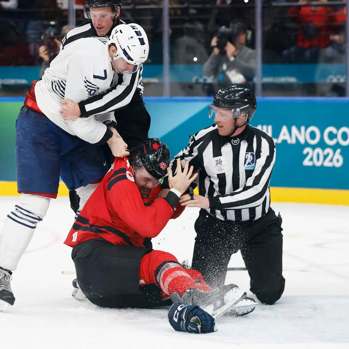 Milano Cortina 2026 Olympics - Ice Hockey - Men's Preliminary Round - Group A - Canada vs France - Milano Santagiulia Ice Hockey Arena, Milan, Italy - February 15, 2026. Tom Wilson of Canada clashes with Pierre Crinon of France REUTERS/David W Cerny
