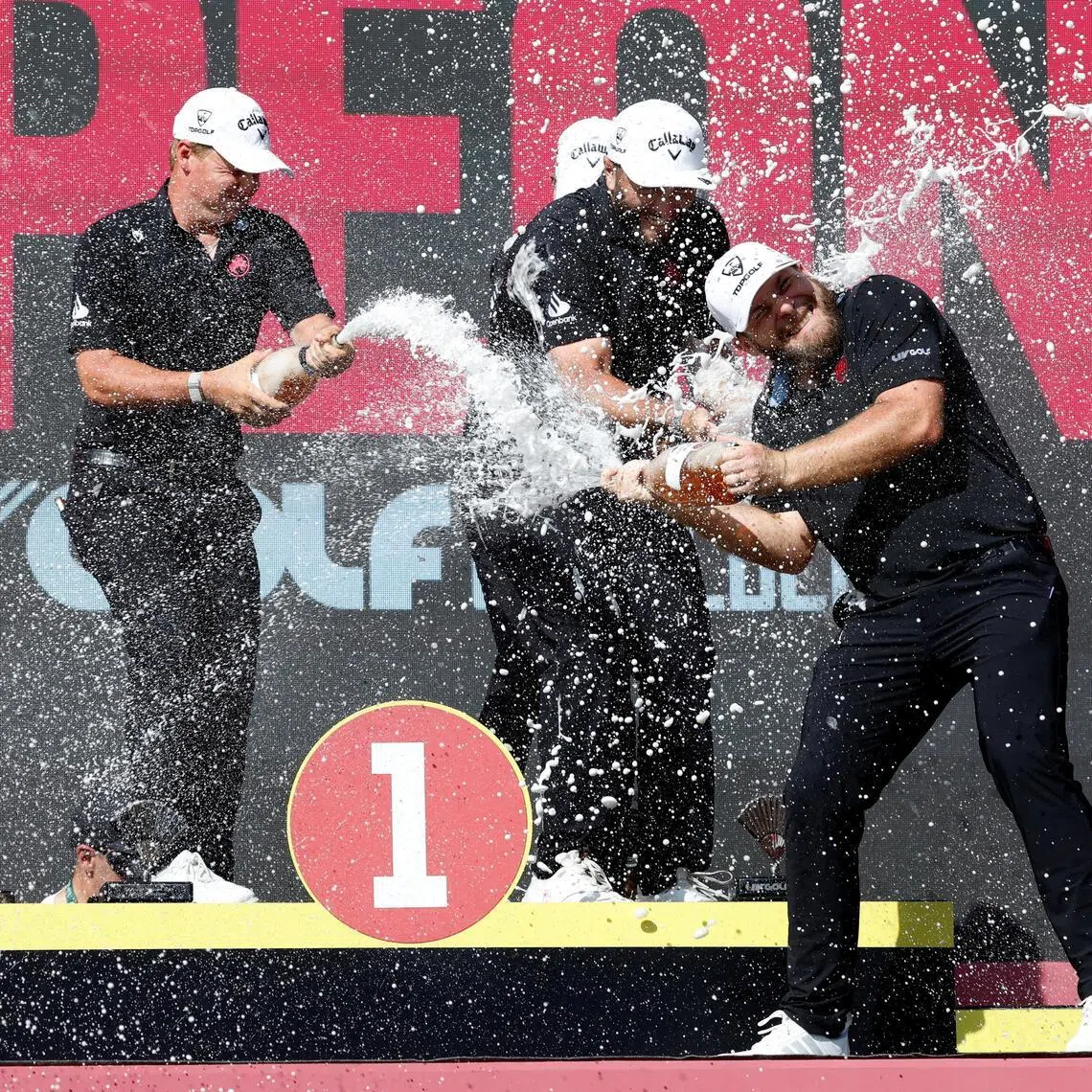 Legion XIII's Tyrrell Hatton celebrating with his teammates Caleb Surratt, Tom McKibbin and Jon Rahm after winning LIV Golf Andalucia on June 7.