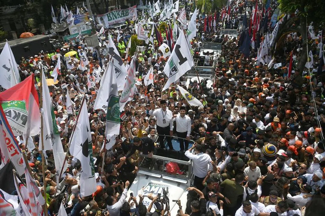 Anies Baswedan, former Jakarta Governor who will run as the presidential candidate for next year's presidential election and his running mate Muhaimin Iskandar, who is the chairman of National Awakening Party (PKB), wave as they arrive at the election commission to register themselves, in Jakarta, Indonesia, October 19, 2023, in this photo taken by Antara Foto. Antara Foto/Aditya Pradana Putra/ via REUTERS