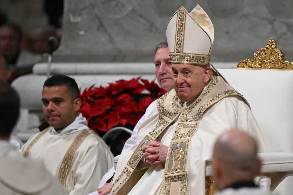 Pope Francis leads the Christmas Night Mass at St Peter's Basilica in Vatican City, on Dec 24.