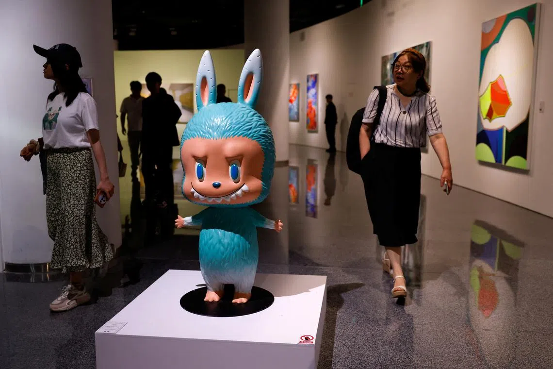 A human-sized Labubu figurine is displayed before an auction in Beijing on June 6.