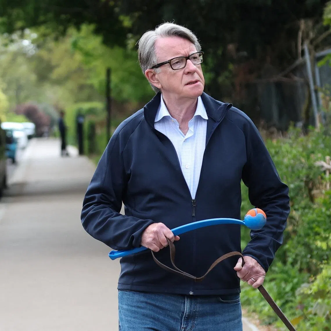 Former British ambassador to the U.S. Peter Mandelson walks with his dog outside his residence, in London, Britain, April 20, 2026. REUTERS/Toby Melville