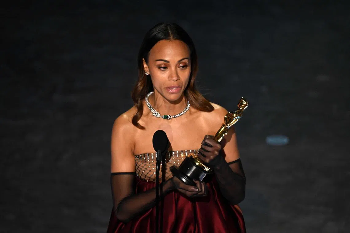 US actress Zoe Saldana accepts the award for Best Actress in a Supporting Role for Emilia Perez onstage during the 97th Annual Academy Awards at the Dolby Theatre in Hollywood on March 2.