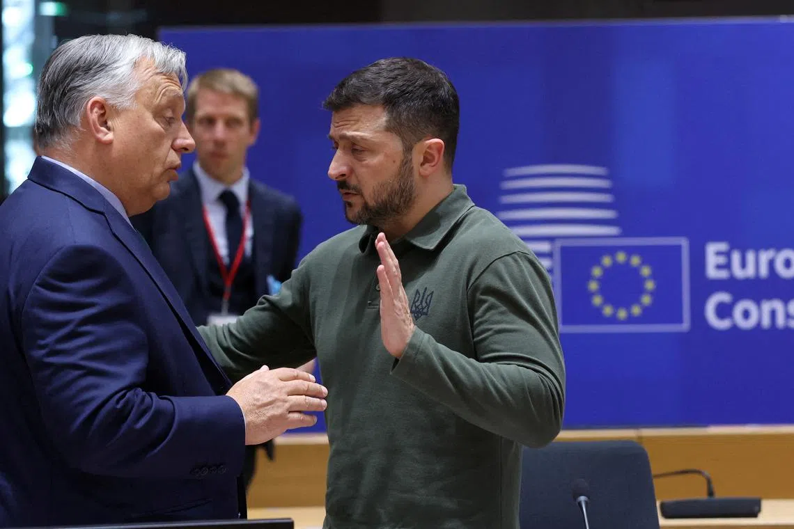 FILE PHOTO: Hungarian Prime Minister Viktor Orban and Ukraine's President Volodymyr Zelenskiy attend a European Union leaders' summit in Brussels, Belgium June 27, 2024. OLIVIER HOSLET/Pool via REUTERS/File Photo