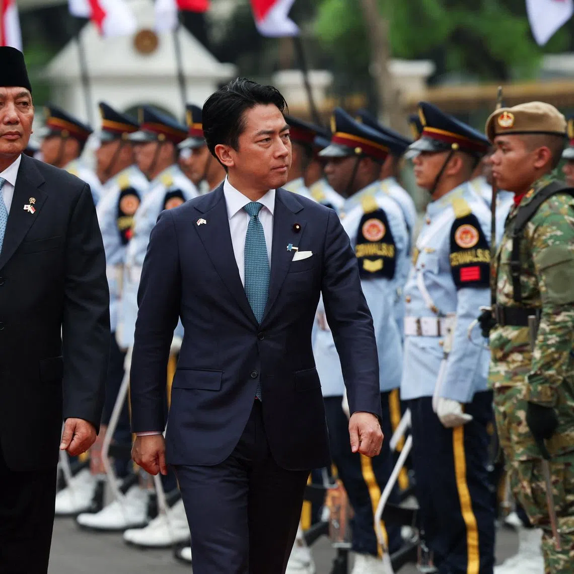 Japan's Defence Minister Shinjiro Koizumi with Indonesia's Defence Minister Sjafrie Sjamsoeddin inspects the honour guards during a welcome ceremony in Jakarta, Indonesia, May 4, 2026. REUTERS/Ajeng Dinar Ulfiana