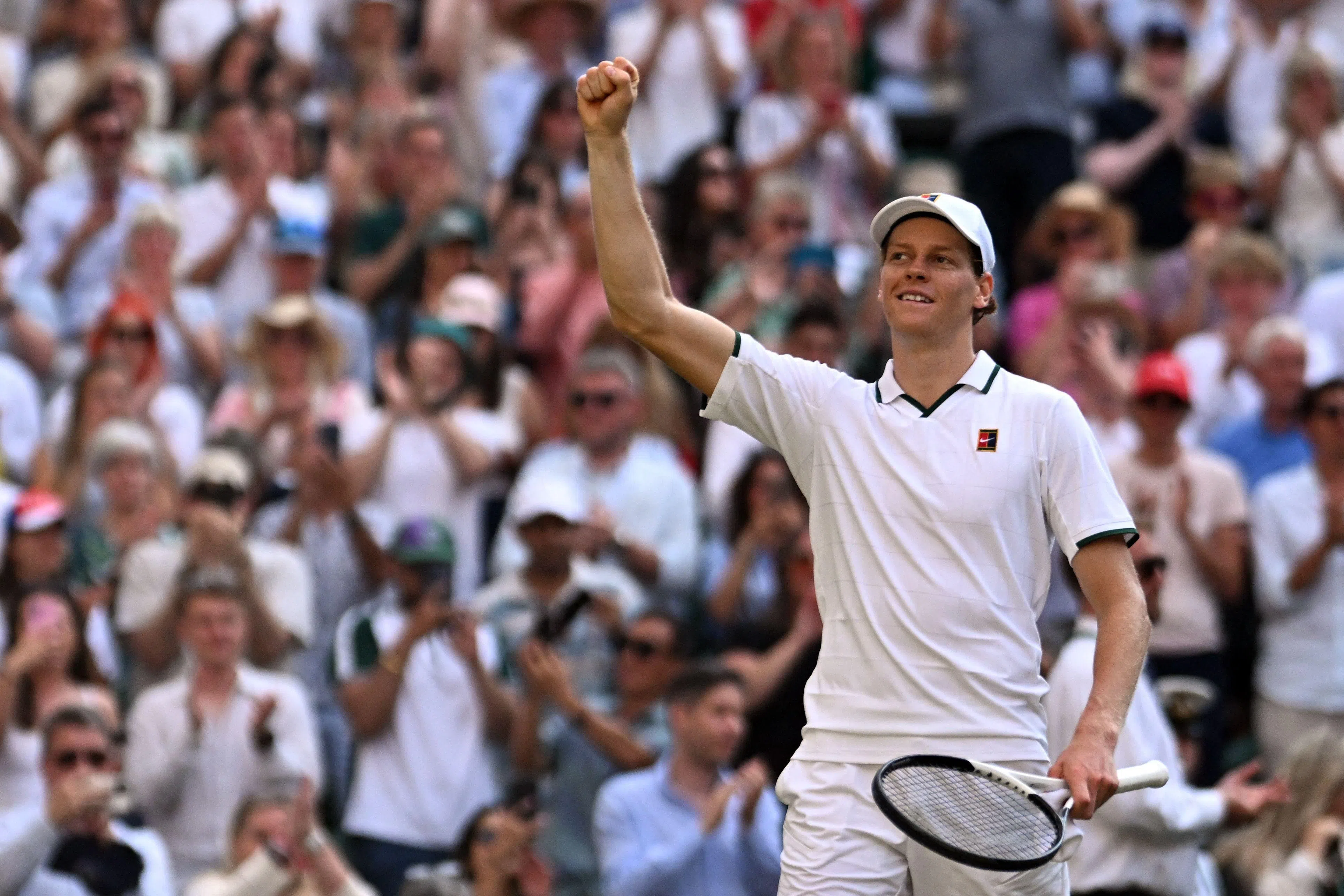 Italy's Jannik Sinner celebrates beating Serbia's Novak Djokovic during their men's singles semi-final tennis match on the twelfth day of the 2026 Wimbledon Championships at The All England Lawn Tennis and Croquet Club in Wimbledon, southwest London, on July 10, 2026. (Photo by Kirill KUDRYAVTSEV / AFP) / RESTRICTED TO EDITORIAL USE