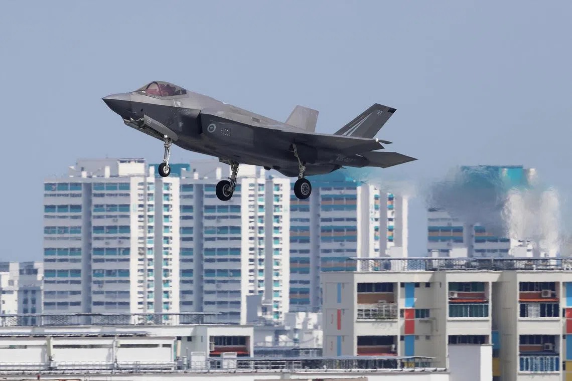mybersama10 - A Royal Australian Air Force F-35A Lightning II stealth fighter on final approach for landing at Paya Lebar Air Base after an Exercise Bersama Lima mission with the HDB flats at Ubi and Marine Terrace in the background.