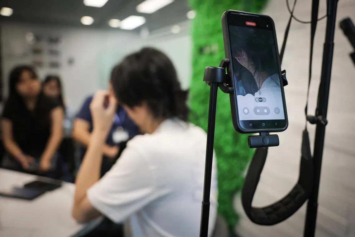 Scam victim Mike Chen (not his real name) during an interview with the media arranged by the police on May 5.