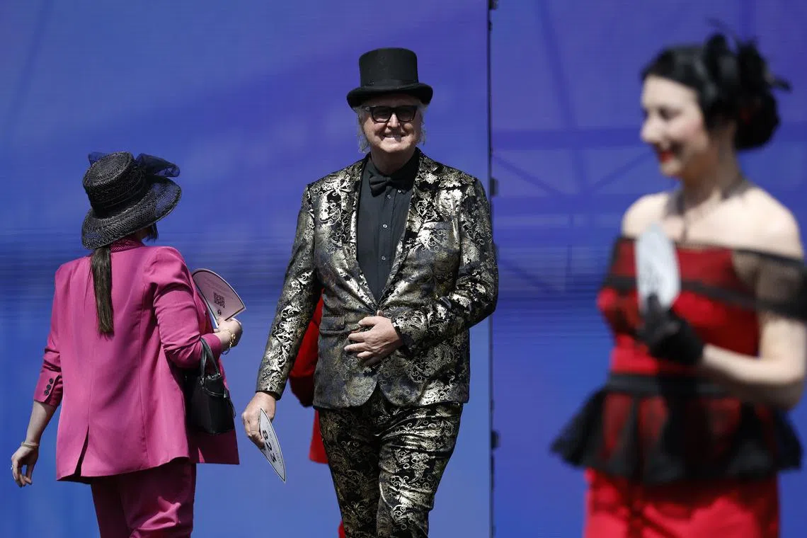 Participants in the 'Fashions on the Field' are seen during Melbourne Cup Day at Flemington Racecourse in Melbourne, Australia on Nov 7, 2023.  