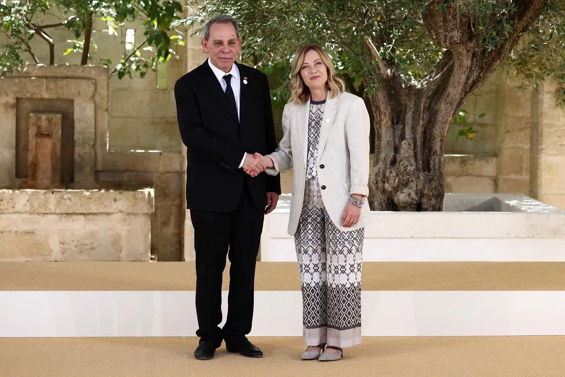FILE PHOTO: Tunisia's Prime Minister Ahmed Hachani  is welcomed by Italian Prime Minister Giorgia Meloni on the second day of the G7 summit, at the Borgo Egnazia resort, in Savelletri, Italy June 14, 2024. REUTERS/Guglielmo Mangiapane/File Photo