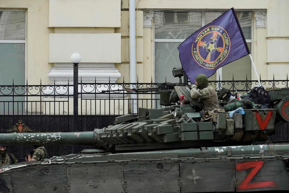 Members of Wagner group sit atop of a tank in a street in the city of Rostov-on-Don, on June 24, 2023. 