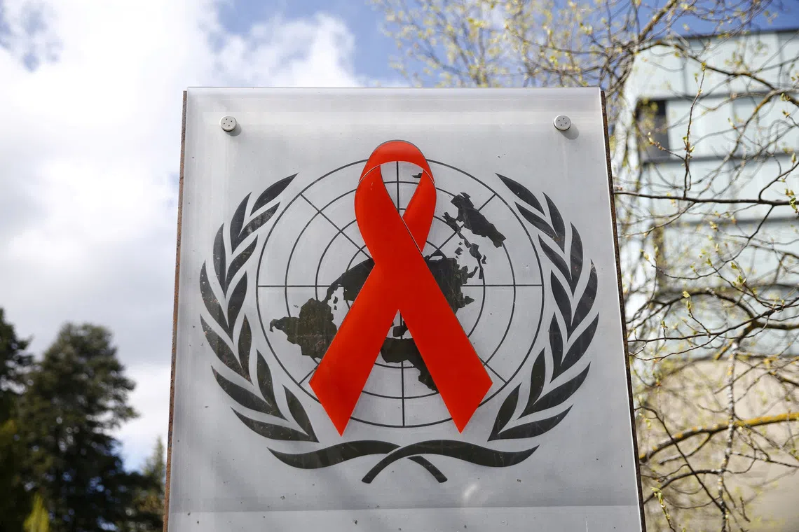 FILE PHOTO: A logo is pictured outside a building of the United Nations AIDS agency (UNAIDS) in Geneva, Switzerland, April 6, 2021/Denis Balibouse/File Photo