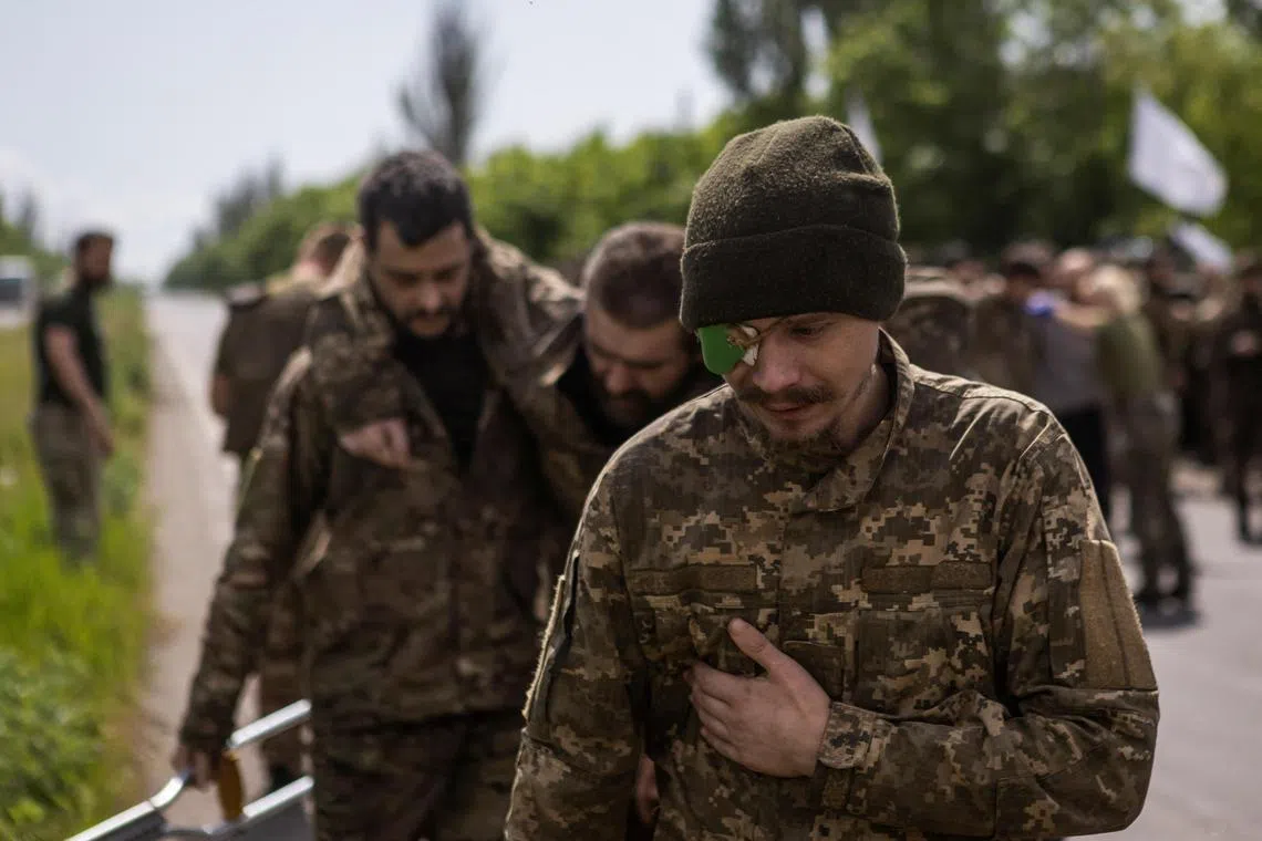 Ukrainian prisoners of war are seen after a swop in Ukraine's Donetsk region, in May 2023.