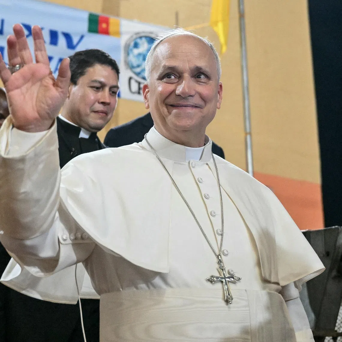 Pope Leo XIV waves to supporters as he leaves after his visit to the Ngul Zamba (Power of God) orphanage in Yaounde, Cameroon, during an apostolic journey to Africa, on April 15, 2026.     ALBERTO PIZZOLI/Pool via REUTERS