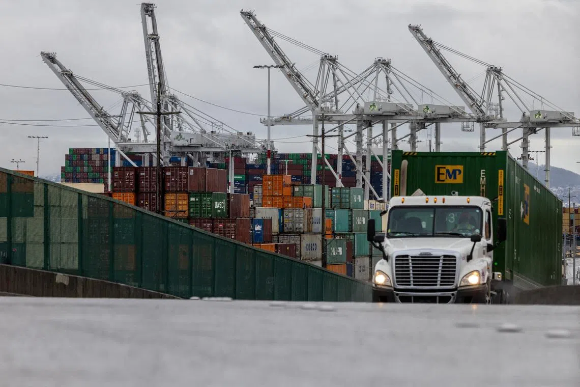 FILE PHOTO: Shipping containers are seen at the port of Oakland, as trade tensions continued over U.S. tariffs with China, in Oakland, California, U.S., May 12, 2025. REUTERS/Carlos Barria/File Photo