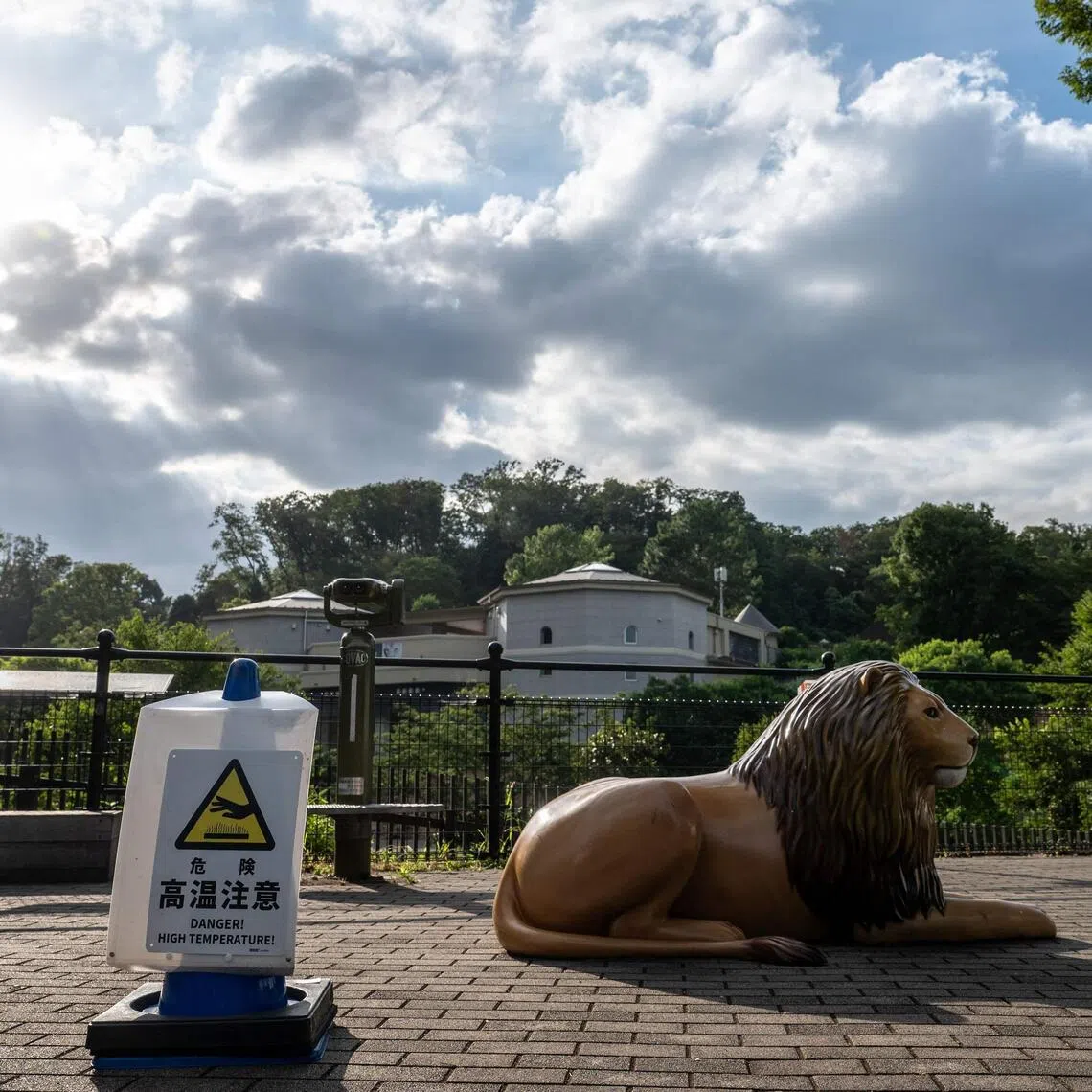A high temperature warning sign at the Tama Zoological Park in Hino, Japan on Aug 4.
