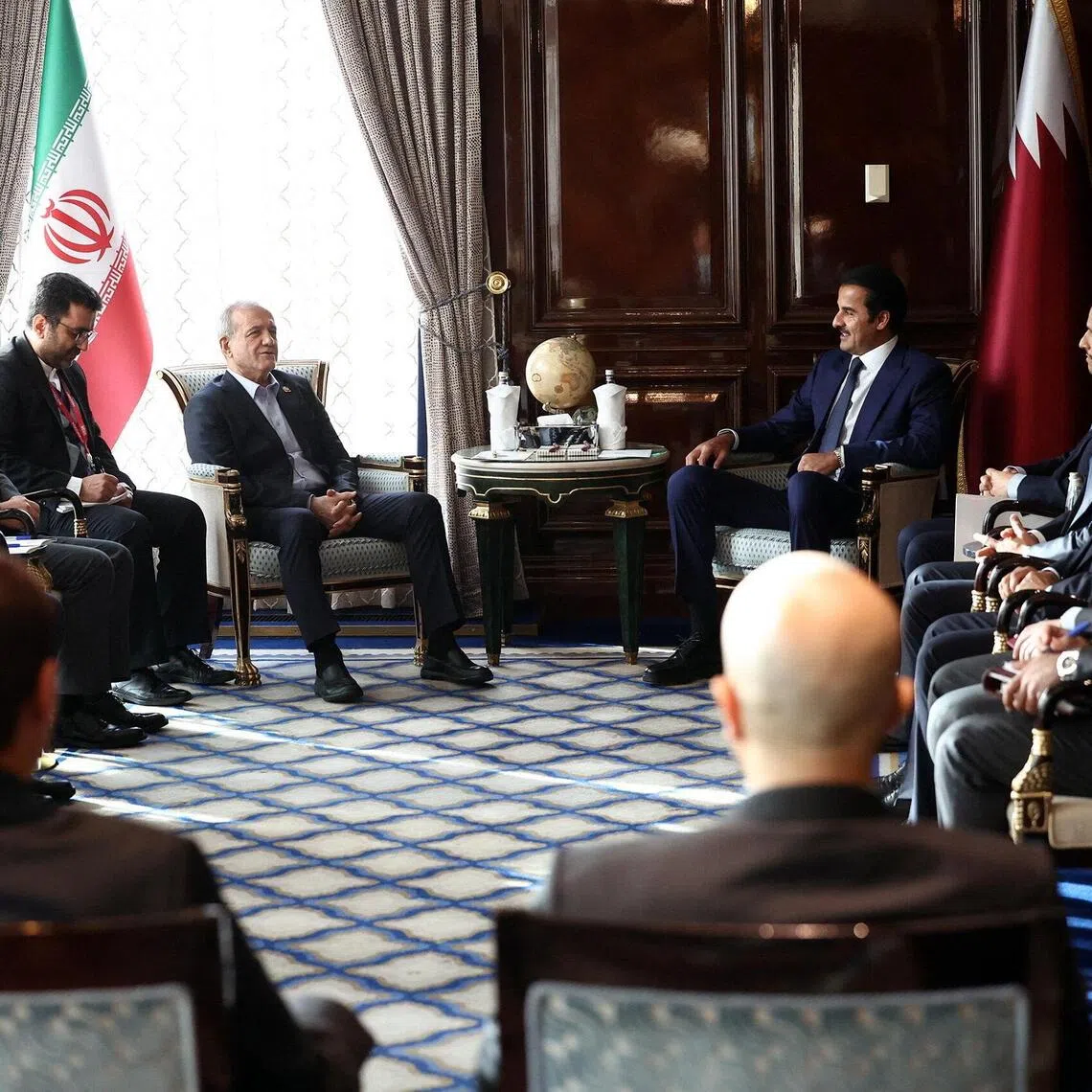 Iranian President Masoud Pezeshkian meeting Qatari Emir Sheikh Tamim bin Hamad Al Thani in Moscow, Russia, on Oct 27.